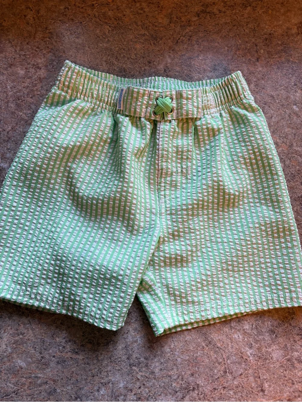 Ruffle Butts Green and White Seersucker Swim Trunks